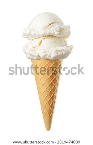 Vanilla ice cream scoops served on a crispy waffle cone isolated on white background