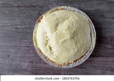 Vanilla Pudding Pie With Graham Cracker Crust In Tin Pie Pan