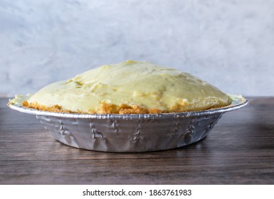 Vanilla Pudding Pie With Graham Cracker Crust In Tin Pie Pan