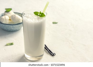 Vanilla Shake With Ice Cream And Mint On White Background. Vanilla Ice Cream Milk Shake. Banana Smoothie With Mint And Vanilla.