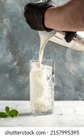 Vanilla Shake With Ice Cream And Mint On White Background. Vanilla Ice Cream Milk Shake. Banana Smoothie With Mint And Vanilla.