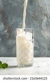 Vanilla Shake With Ice Cream And Mint On White Background. Vanilla Ice Cream Milk Shake. Banana Smoothie With Mint And Vanilla.