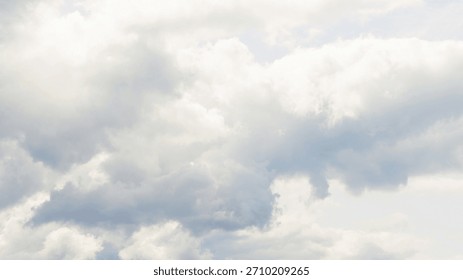 Vanilla sky clouds background in Cloud Dancer color trend. Minimal blue sky backdrop with calm atmosphere