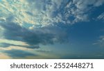 Vanilla Sky With White Clouds. Summer Sunset Sky Panorama With Fleece Colorful Clouds.