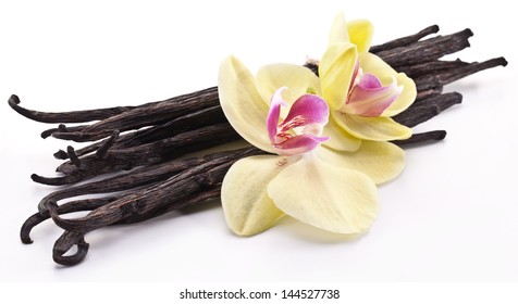 Vanilla sticks with a vanilla flower isolated on a white background.