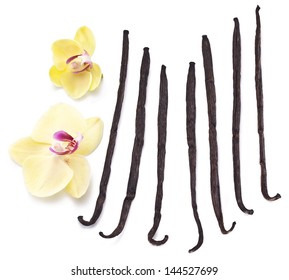 Vanilla Sticks With A Flower On A White Background.