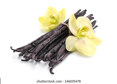 Vanilla Sticks With A Flower On A White Background.