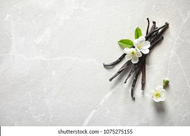 Vanilla Sticks And Flowers On Light Background