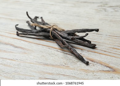 Vanilla sticks on wooden background
