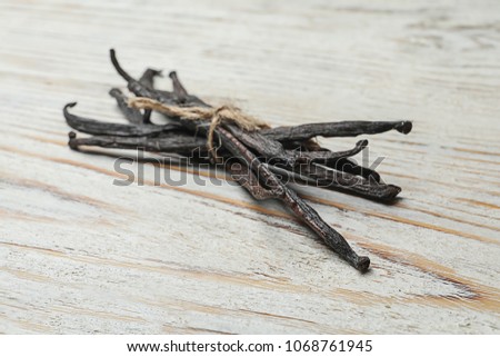 Vanilla sticks on wooden background 商業照片 © 