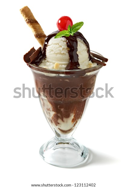Vanilla sundae ice cream with sauce,
syrup or sherbet and wafer stick, sweet cherry, mint and chocolate
curls in sundae glass isolated on white background
