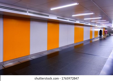 Vanishing Perspective View Of Pedestrian Underpass Tunnel With Empty Walls / Blank Billboard Spaces. Visual For Ad Placements; Presentation Display; Advertising OOH Mockup / Mock Up.