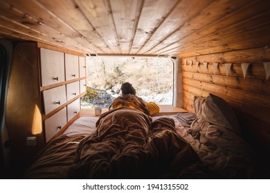 Vanlife - Young Woman Lying In Camping Van And Looking At Beautiful Nature