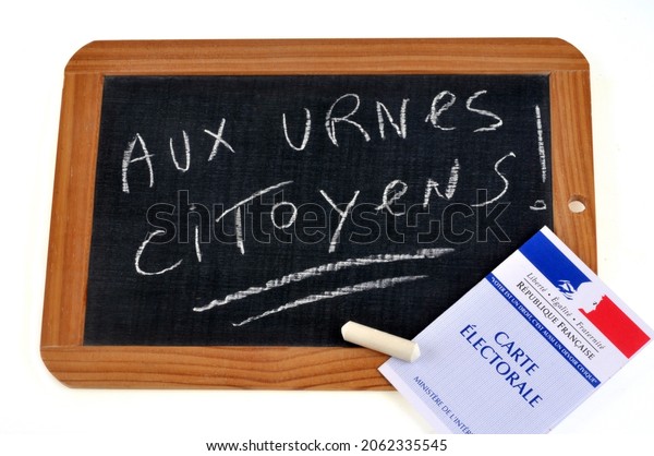 Vannes, France, October 17, 2021: French electoral card placed on a school slate on which citizens are chalked at the ballot box 