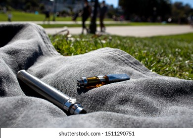 Vape Cartridge Outside At Public Park