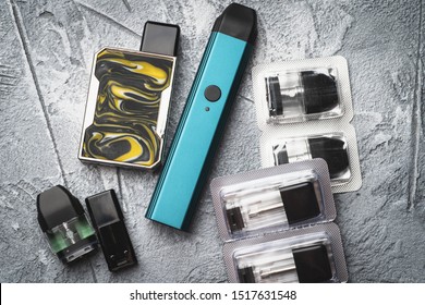 Vape pod system or pod mod with changeable cartridges close up - newest generation of vaping products - small size devices for inhaling higher nicotine strengths.