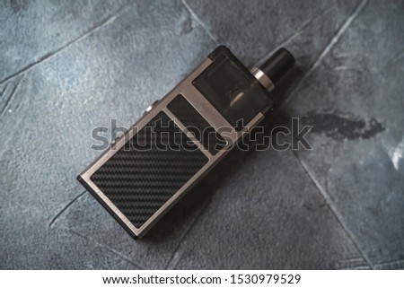 Vape pod system or pod mod with changeable cartridges close up - newest generation of vaping products - small size devices for inhaling higher nicotine strengths.