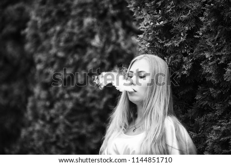 Similar – Image, Stock Photo Pretty blond girl with long hair smoking