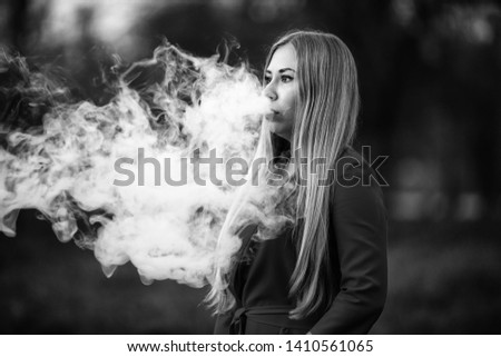 Similar – Image, Stock Photo Pretty blond girl with long hair smoking