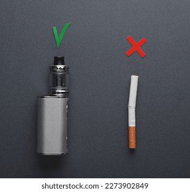 Vaping device with checkmark accept sign and cigarette with reject cross symbol on dark background - Shutterstock ID 2273902849