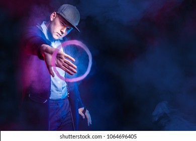 Vaping. Vape Trick Rings In Performance Of Vaper On Red Blue Background. Vape Rings.