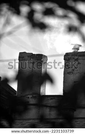 Vapor from Cracked Brick Chimney in Black and White