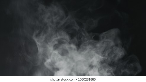 vapor steam rising over black background - Shutterstock ID 1080281885