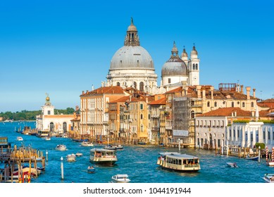 Vaporetto sail in Venice, Italy. Scenic view of tourist boats on Grand Canal, sky and water. Nice cityscape of Venice in summer. Theme of travel in Venice, tourism in Europe, vacation and vaporetto.