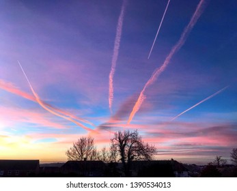 Vapour trails in the evening sky.