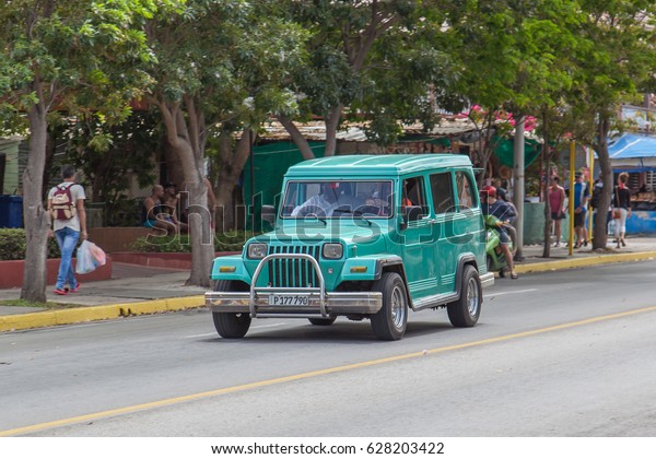VARADERO, CUBA - APR 20, 2017: American\
classic car drive on the street in Varadero, Cuba\
\
