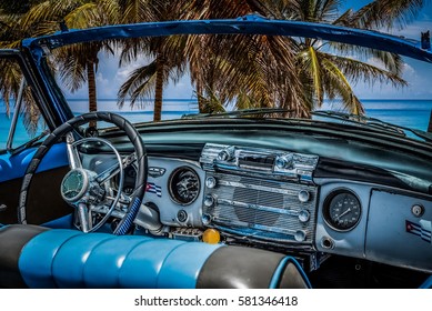 Varadero, Cuba - June 17, 2015: HDR - Interior view from a american convertible vintage car with view of the beach and the Caribbean Sea - Serie Cuba Reportage