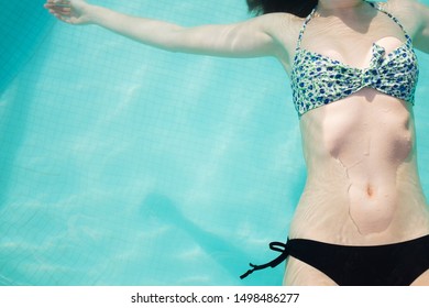 Varadero / Cuba - May 17 2014: Torso Of Woman In Bikini Floating In Resort Pool, Overhead View