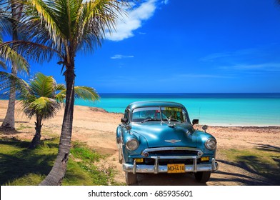 VARADERO, CUBA - MAY, 22, 2013: Blue american classic car on the beach