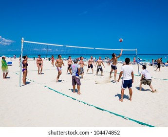 VARADERO,CUBA-MAY 27:Young tourists playing volleyball May 27,2012 in Varadero.With over a million visitors per year,Varadero is the main destination for the growing cuban tourism industry