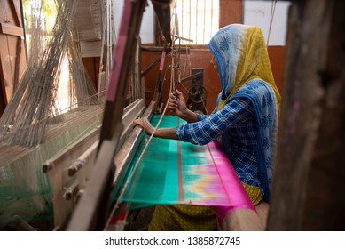 Varanasi / India 24 April 2019 Muslim Girl Weaving A Banarasi Saree On Her Handloom At Village In Varanasi Uttar Pradesh