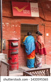 VARANASI, INDIA - FEBRUARY 11, 2015: Two Indian Women A At India Post Office In Varanasi, India.