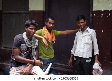 Varanasi, India - July 29, 2016: Three Men Standing Together In An Alley In Varanasi.