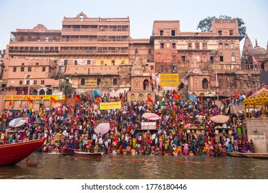 Varanasi, India/November 23, 2018: Pilgrims take a holy dip at Ahilyabai Ghat which is on the River Ganges during Kartik Purnima in Varanasi, Banaras, Kashi, Uttar Pradesh, India.
