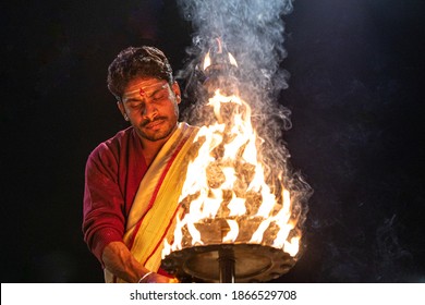 Varanasi, Uttar Pradesh, India - February 15th 2020 : Aarti is a Hindu religious ritual of worship, a part of puja, in which light is offered to one or more deities.