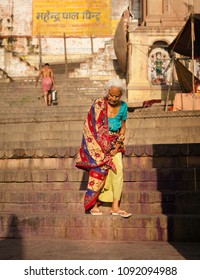 Varanasi/India - March 6, 2018: One of hundreds of devotes that make their way each morning to bathe in the Ganges. - Shutterstock ID 1092094988
