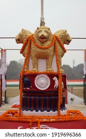 Varanasi,Uttar Prades,India-Jan 26 2021: Close Up Shot Of Indian National Emblem And Golden Loin Capital With Garland On The Occasion Of Republic Day With Selective Focus. Varanasi Police Reserve.