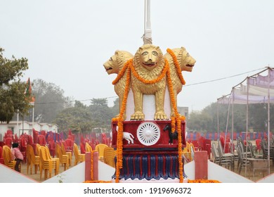 Varanasi,Uttar Prades,India-Jan 26 2021: Close Up Shot Of Indian National Emblem And Golden Loin Capital With Garland On The Occasion Of Republic Day With Selective Focus. Varanasi Police Reserve.