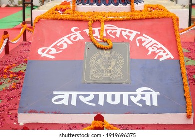 Varanasi,Uttar Prades,India-Jan 26 2021: Close Up Shot Of Indian National Emblem And Golden Loin Capital With Garland On The Occasion Of Republic Day With Selective Focus. Varanasi Police Reserve.