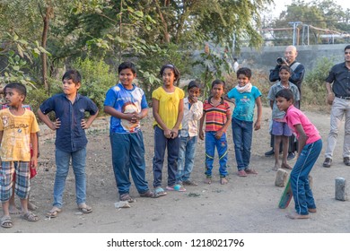 Vari Village, Maharashtra, India -January 9, 2018: Poor But Lovely Hindu Boys And Girls Playing Cricket . Daily Life In Indian Villages Near Godavari River