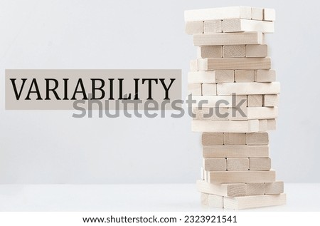 VARIABILITY text with wooden block stack on a white background , business concept