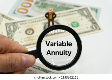 Variable Annuity.Magnifying Glass Showing The Words.Background Of Banknotes And Coins.basic Concepts Of Finance.Business Theme.Financial Terms.