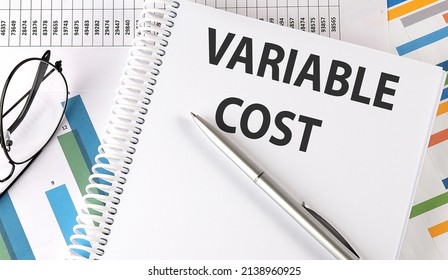 VARIABLE COST , pen and glasses on chart, business concept