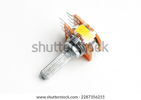 Variable resistor, potentiometer on isolated white background

