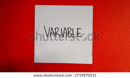 Variable writing on a red background 