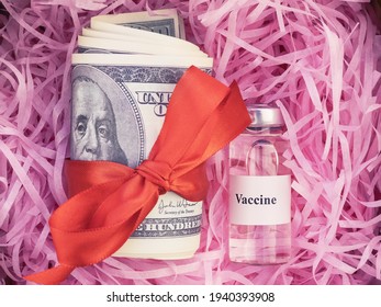 variant of omicron, ampoule with vaccine against the virus with hundred-dollar bills in pink paper filling for boxes, coronavirus, covid-19, SARS-CoV-2, close-up, top view